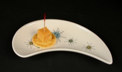 Franciscan Starburst crescent dish with appetizer