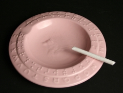 Braille ashtray with candy cigarette