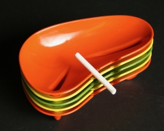 Styled by Kaye LaMoyne melamine ashtrays with candy cigarette