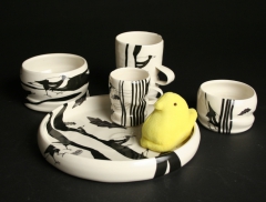 Janet DeBoos Children's dishes with magpies and yellow plush peep