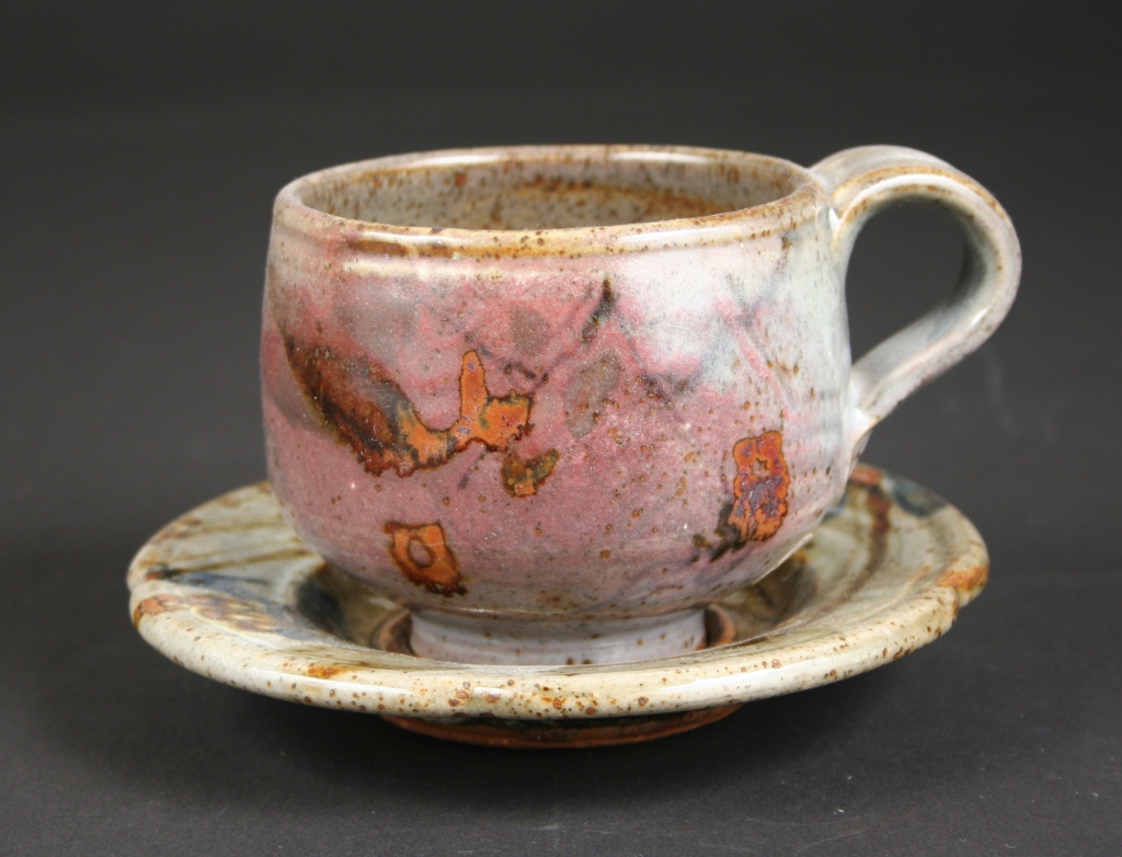 John Glick (American, 1938-2017), cup and saucer, part of a 6-piece place setting created by John Glick, 1979, commissioned by Walter and Joan Mondale for the Vice Presidential Mansion, stoneware, reduction fired, Cone 10, multiple slips & glazes, brush work/calligraphy, Gift of the Artist, 2014.70