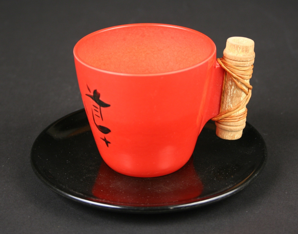 predecessor of Branchell, Co., St. Louis, Missouri (pre-1952), Kaye La Moyne, designer (American, 1918-1992), red melamine/plastic Ebonyte cup and saucer with bamboo handles and Oriental characters, ca. 1949-early 1950s, plastic, with bamboo handles on some pieces, Museum Purchase, 2019.104