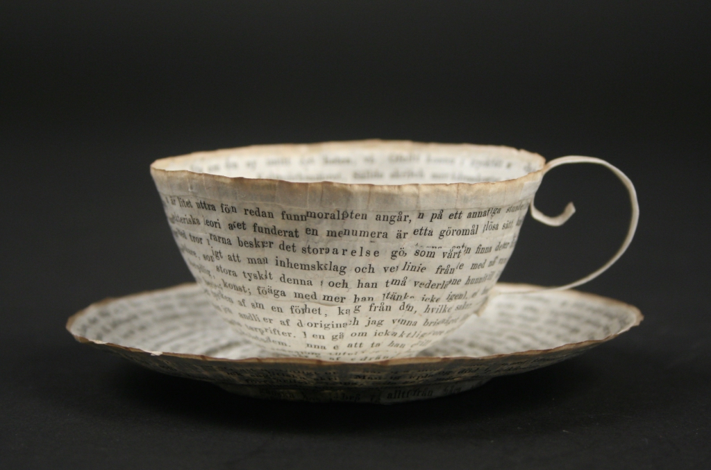 Cecilia Levy (Swedish), cup and saucer, paper art object, 2016, o;d book pages and wheat starch paste, Museum Purchase, 2016.16