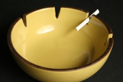 Heath Ceramics, mustard colored ashtray with candy cigarette