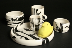 Janet DeBoos Children's dishes with magpies and yellow plush peep